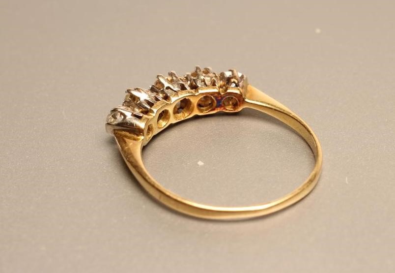 A FIVE STONE DIAMOND RING Image