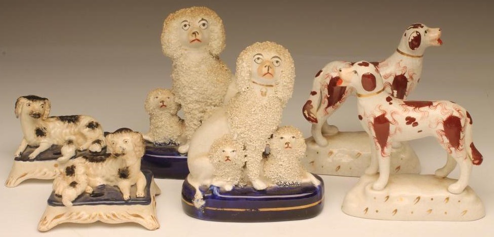 A PAIR OF VICTORIAN STAFFORDSHIRE POTTERY SPANIEL INKWELLS Image