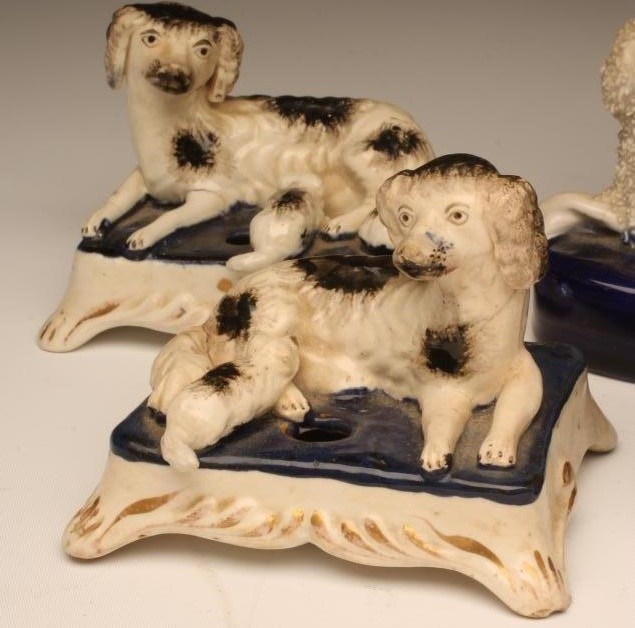 A PAIR OF VICTORIAN STAFFORDSHIRE POTTERY SPANIEL INKWELLS Image