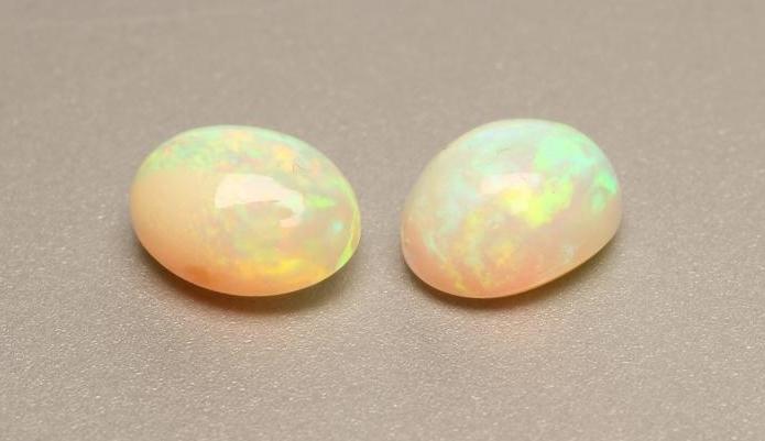 TWO CABOCHON POLISHED OPALS Image