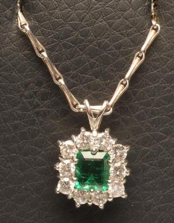AN EMERALD AND DIAMOND PENDANT Image