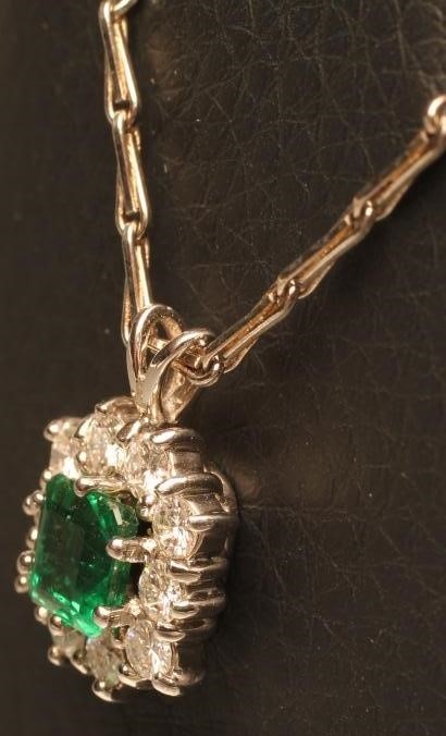 AN EMERALD AND DIAMOND PENDANT Image