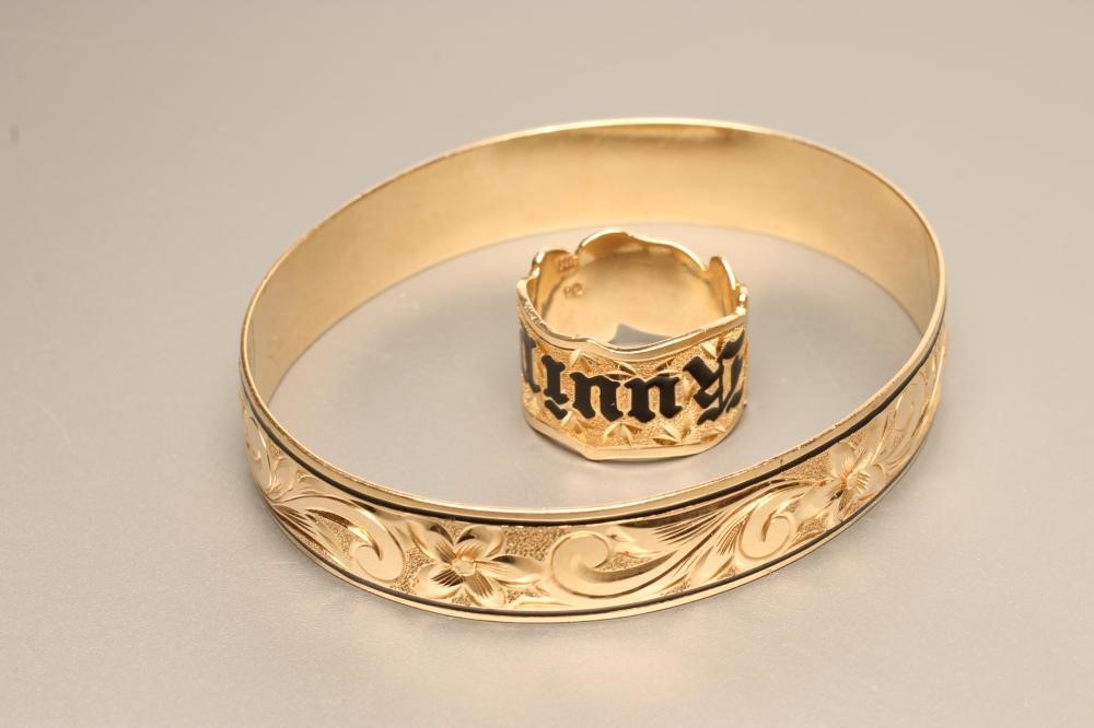 A 14K GOLD AND BLACK ENAMEL BANGLE AND MATCHING RING Image