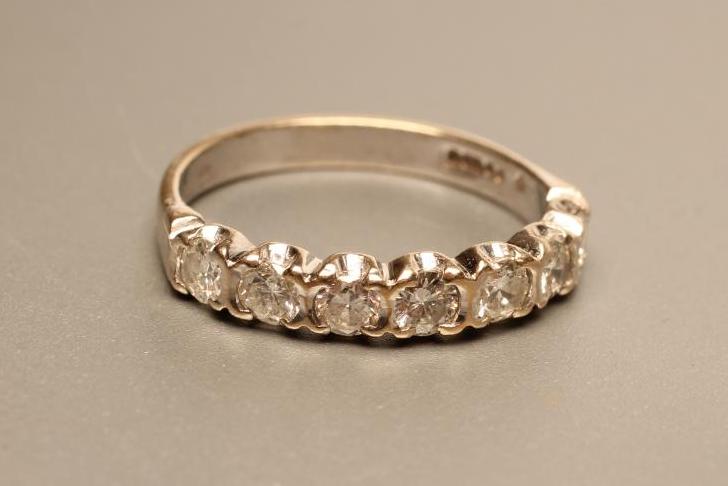 A SEVEN STONE DIAMOND HALF HOOP ETERNITY RING Image