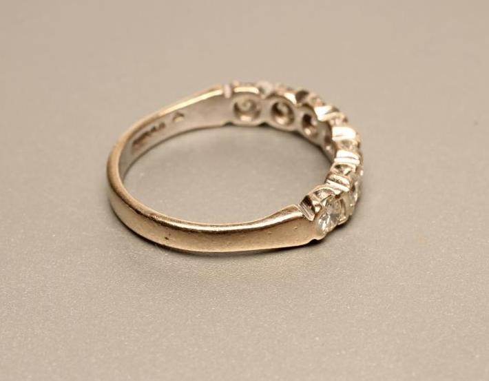 A SEVEN STONE DIAMOND HALF HOOP ETERNITY RING Image