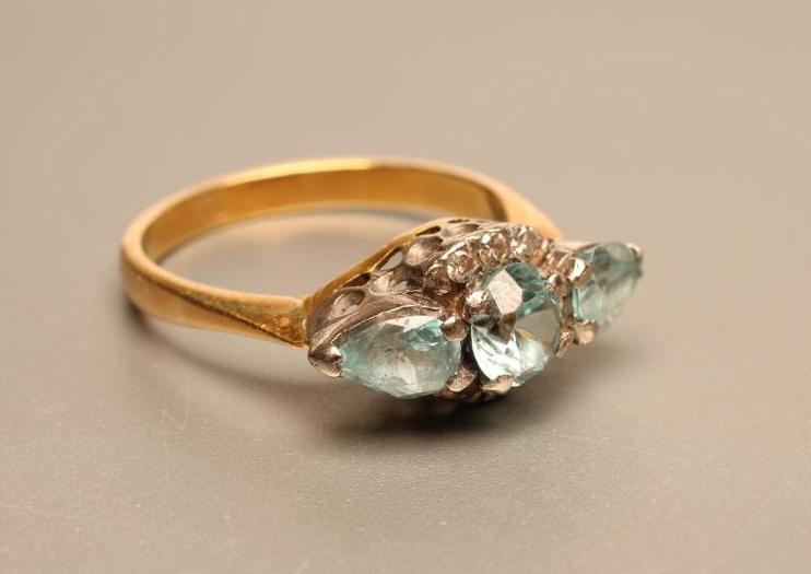 A THREE STONE BLUE ZIRCON RING Image