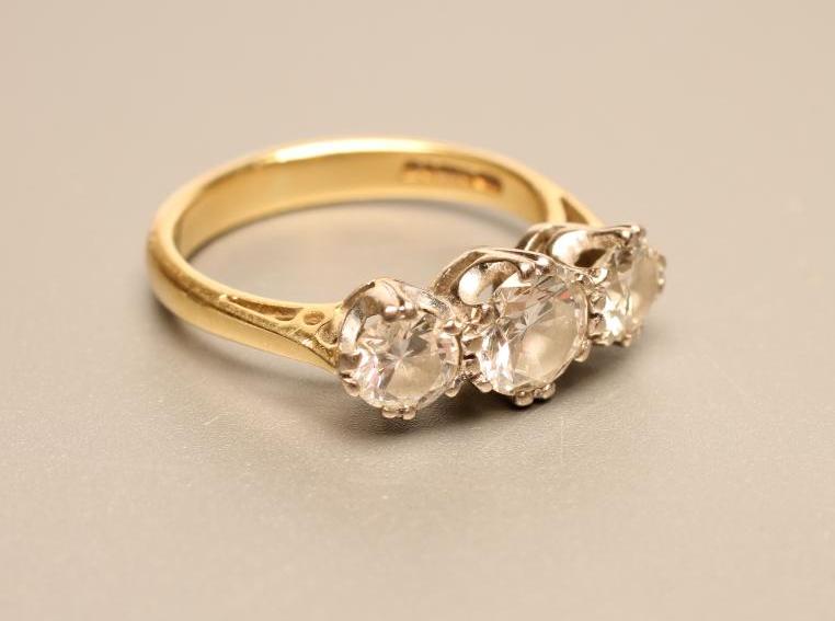 A THREE STONE DIAMOND RING Image