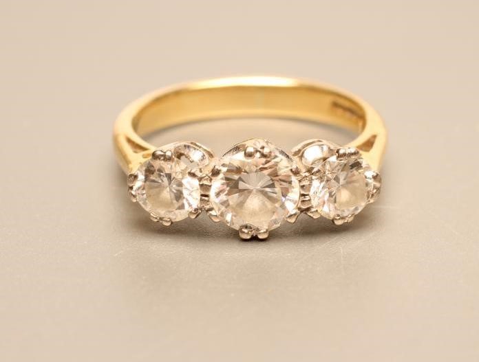 A THREE STONE DIAMOND RING Image