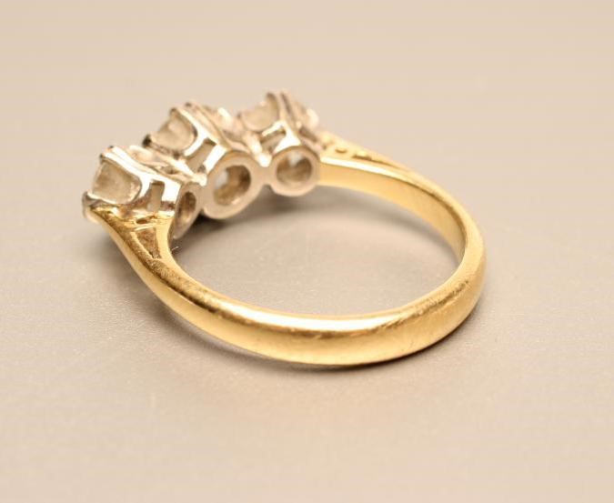 A THREE STONE DIAMOND RING Image