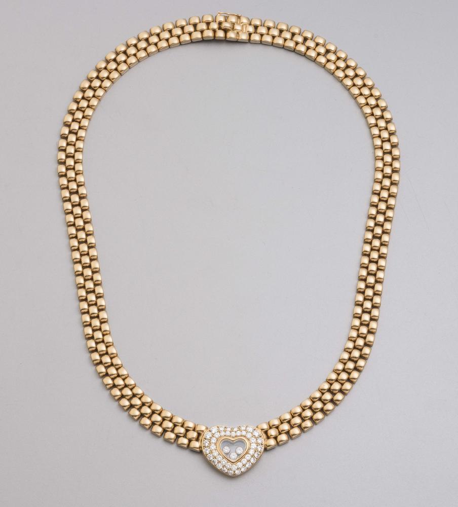 A CHOPARD 18CT GOLD AND DIAMOND NECKLACE Image