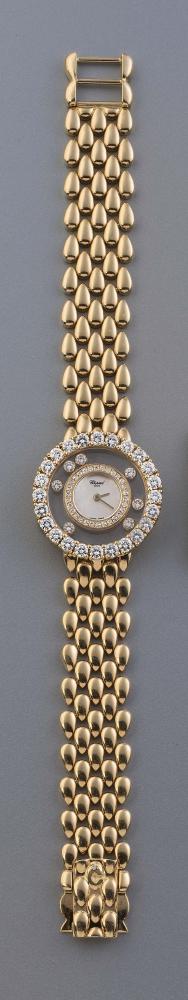 A LADY'S CHOPARD 18CT GOLD "HAPPY DIAMONDS" WRISTWATCH the 1cm mother of pearl dial inscribed Image