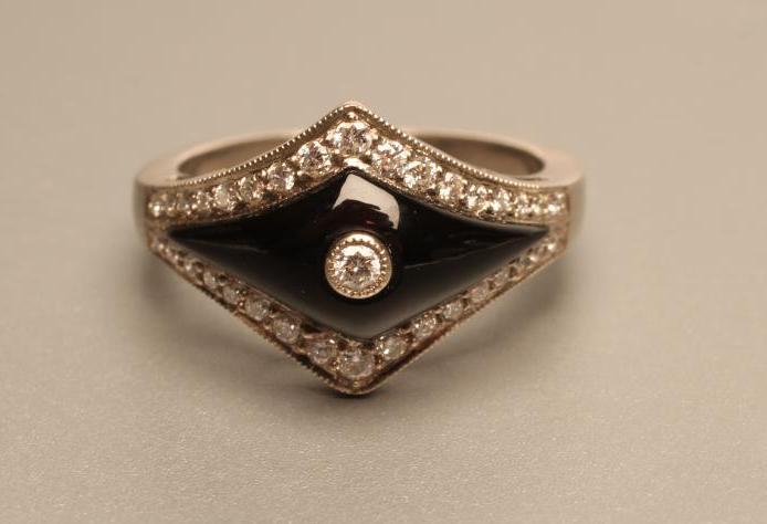 AN ART DECO STYLE DIAMOND AND BLACK ONYX COCKTAIL RING Image