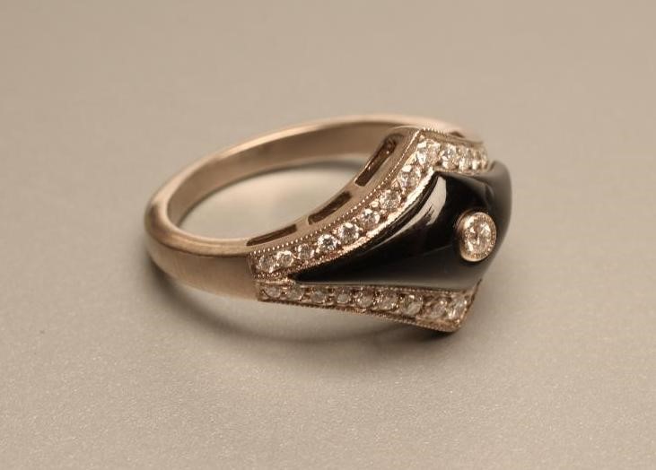 AN ART DECO STYLE DIAMOND AND BLACK ONYX COCKTAIL RING Image