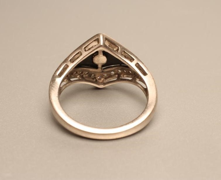 AN ART DECO STYLE DIAMOND AND BLACK ONYX COCKTAIL RING Image