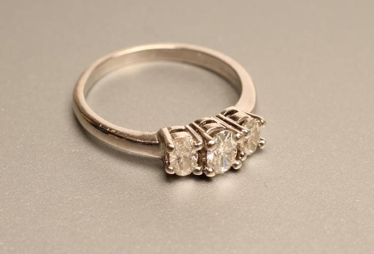 A THREE STONE DIAMOND RING Image