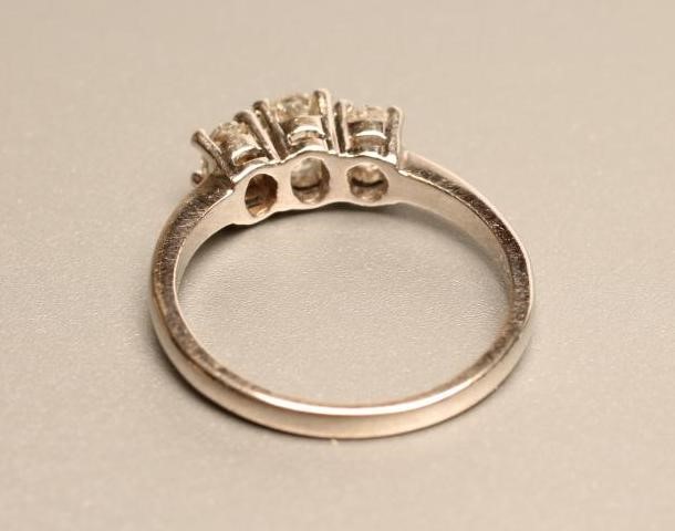 A THREE STONE DIAMOND RING Image