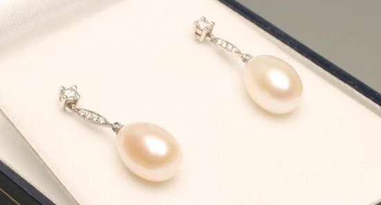 A PAIR OF PEARL AND DIAMOND DROP EAR STUDS Image
