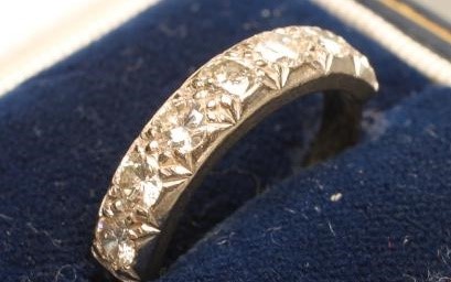 A SEVEN STONE DIAMOND HALF HOOP ETERNITY RING Image