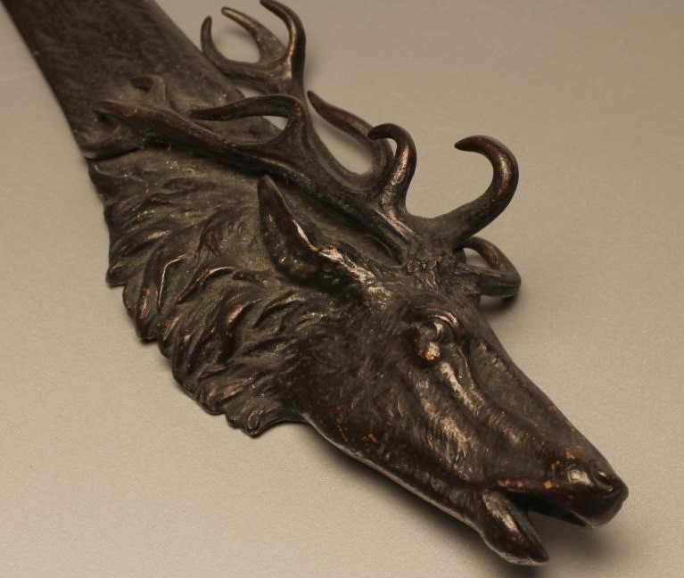 A BRONZE PAPER KNIFE Image