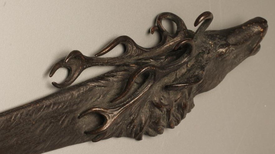 A BRONZE PAPER KNIFE Image