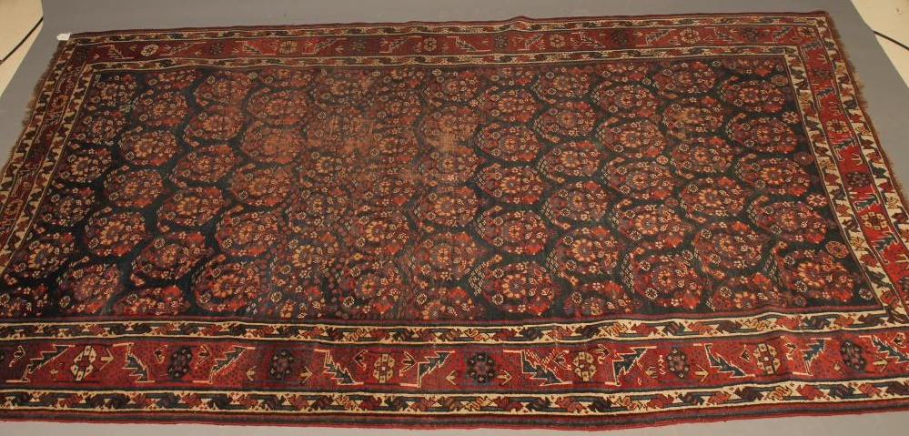 A PERSIAN TRIBAL RUG Image