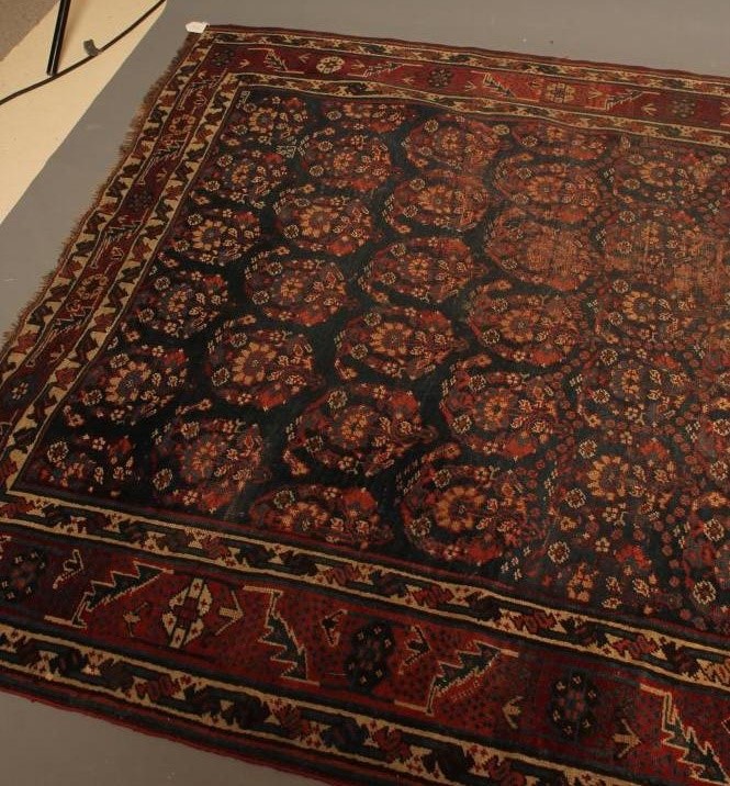 A PERSIAN TRIBAL RUG Image