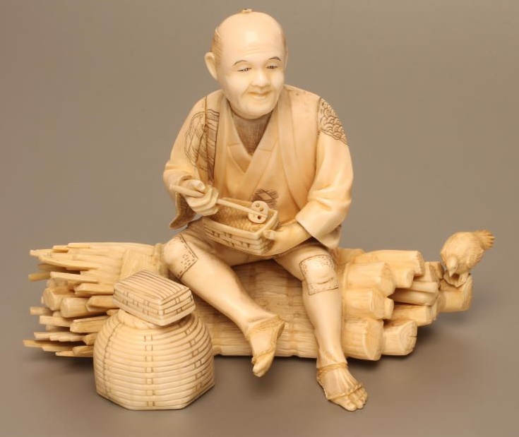 A JAPANESE IVORY OKIMONO Image