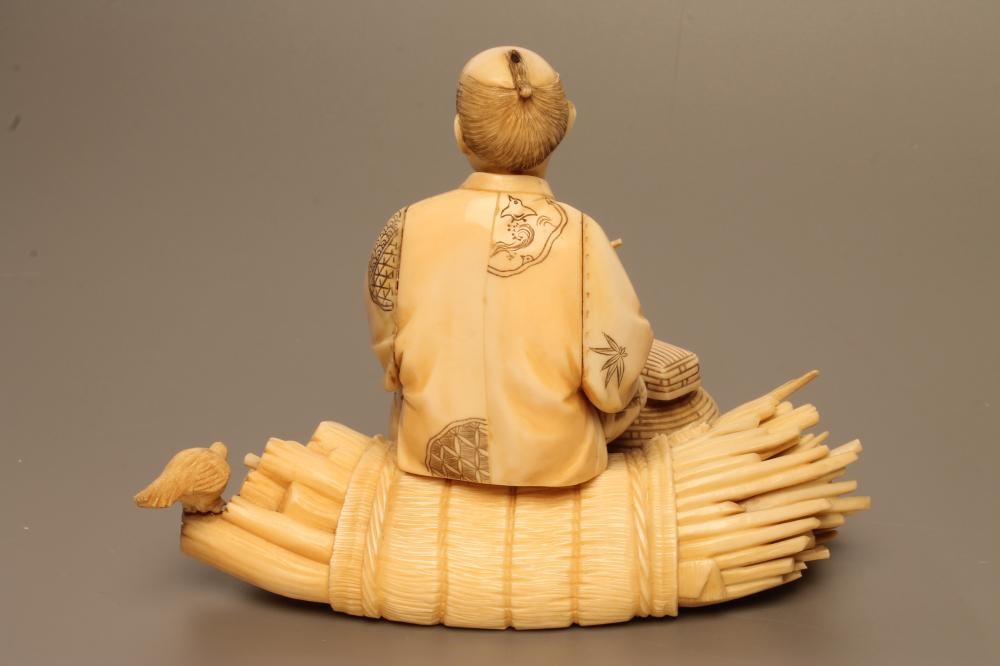 A JAPANESE IVORY OKIMONO Image