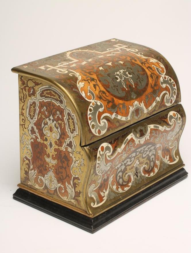 A VICTORIAN STATIONERY CASKET of vertical oblong form with double hinged domed and ogee fall front Image