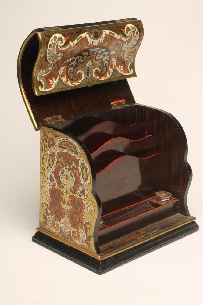 A VICTORIAN STATIONERY CASKET of vertical oblong form with double hinged domed and ogee fall front Image