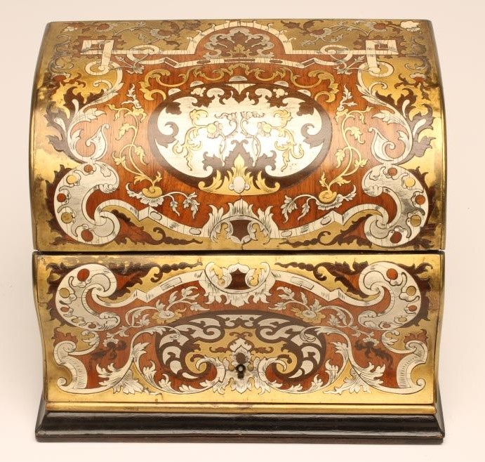 A VICTORIAN STATIONERY CASKET of vertical oblong form with double hinged domed and ogee fall front Image