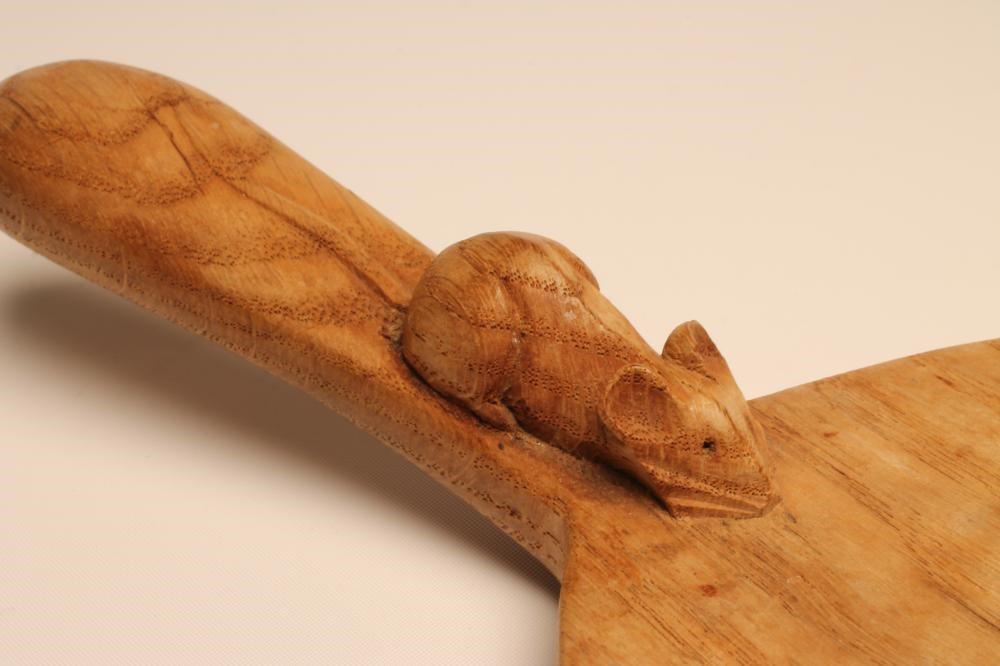 A ROBERT THOMPSON ADZED OAK CHEESE BOARD of oval form Image