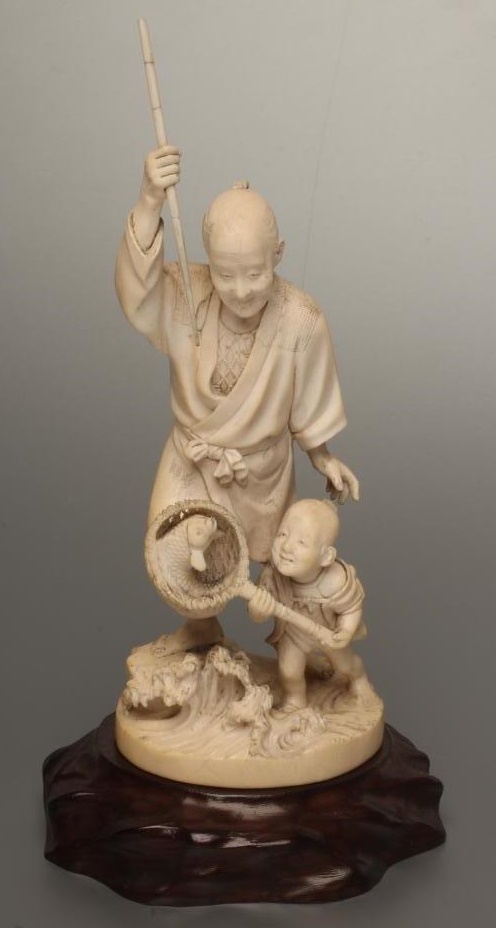 A JAPANESE IVORY OKIMONO Image