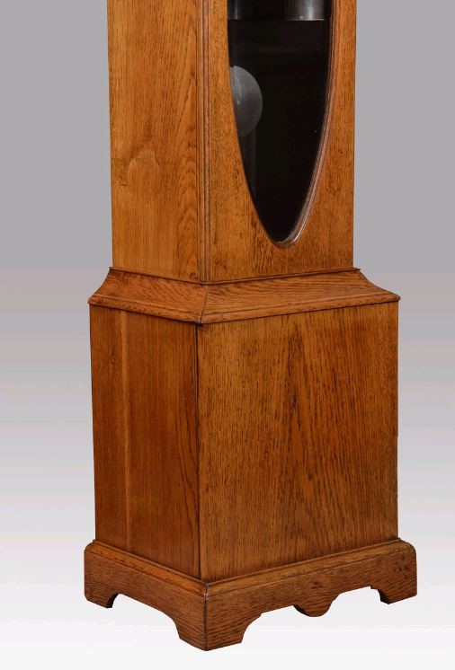 AN OAK CHIMING LONGCASE Image