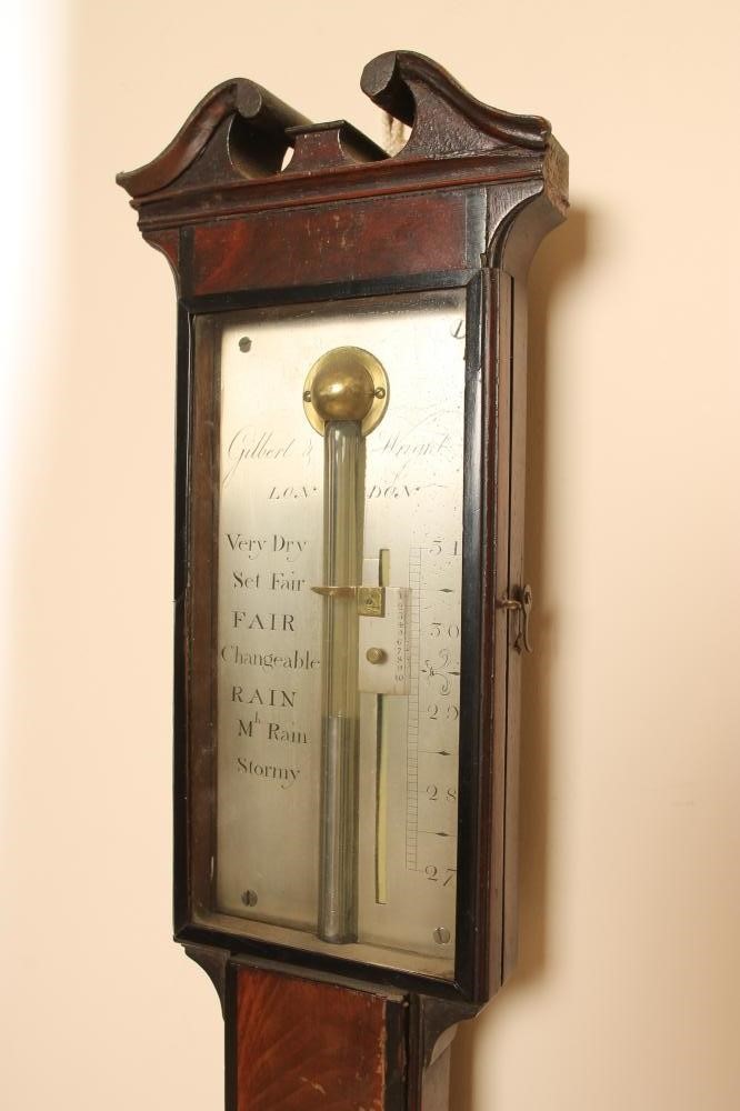 A MAHOGANY CASED STICK BAROMETER by Gilbert & Wright Image