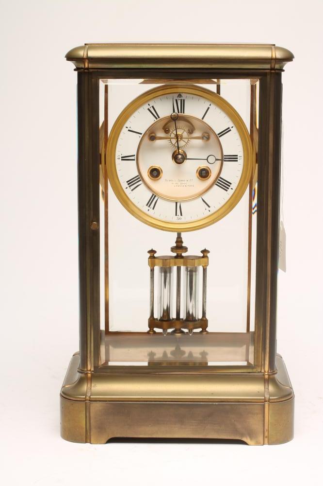 A BRASS CASED FOUR GLASS MANTEL CLOCK Image