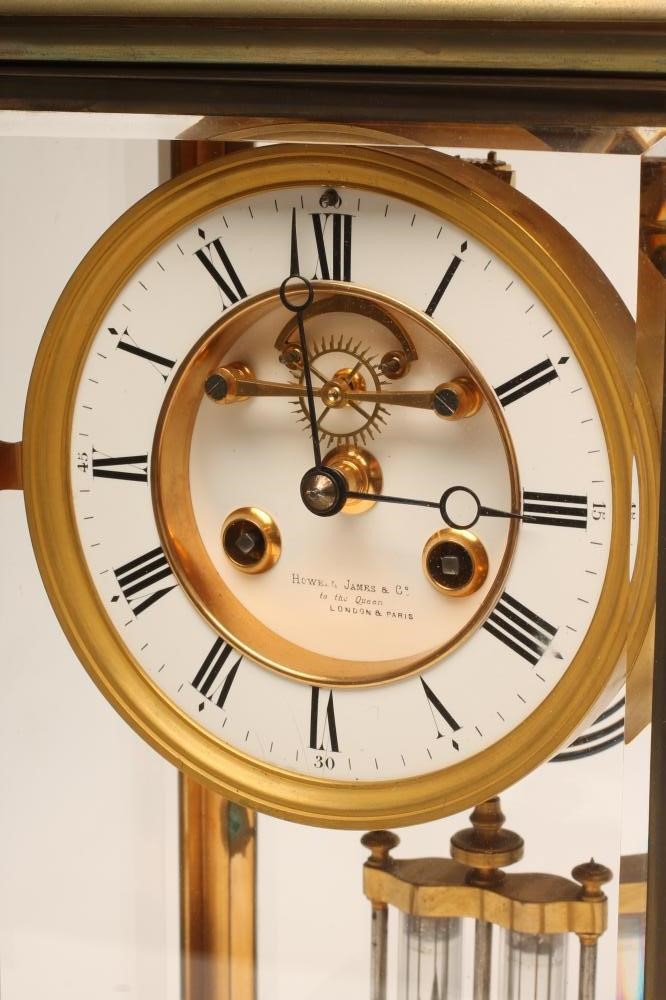 A BRASS CASED FOUR GLASS MANTEL CLOCK Image