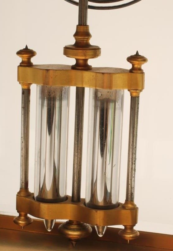 A BRASS CASED FOUR GLASS MANTEL CLOCK Image