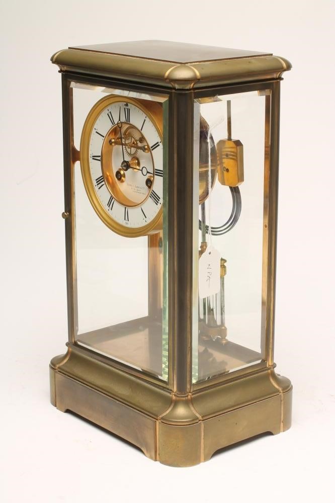 A BRASS CASED FOUR GLASS MANTEL CLOCK Image