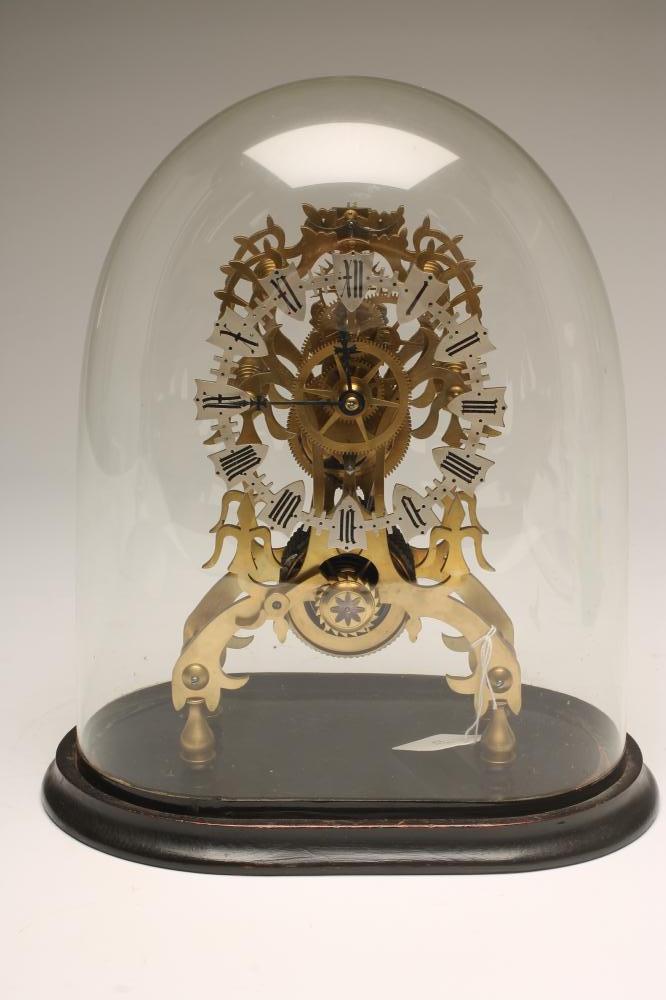 A BRASS SKELETON MANTEL TIMEPIECE Image