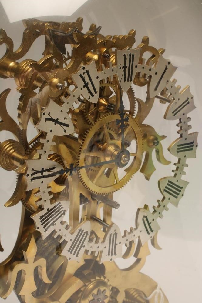A BRASS SKELETON MANTEL TIMEPIECE Image