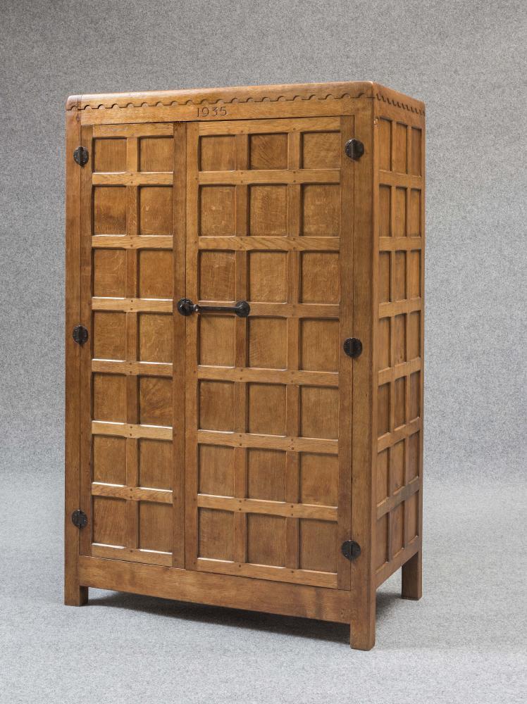 A ROBERT THOMPSON ADZED OAK WARDROBE dated 1935 Image