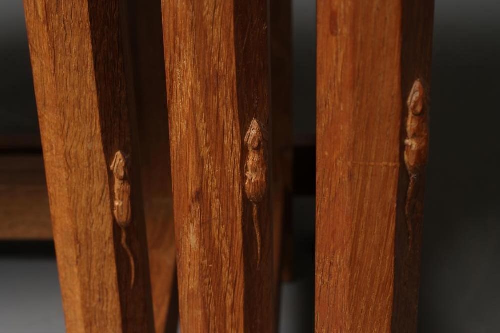 A ROBERT THOMPSON ADZED OAK NEST OF TABLES of rounded oblong form Image