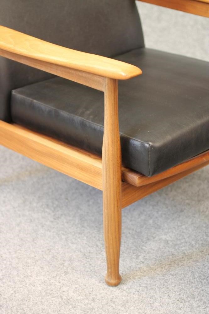 A 1960'S TEAK FRAMED ARMCHAIR with adjustable back and seat Image