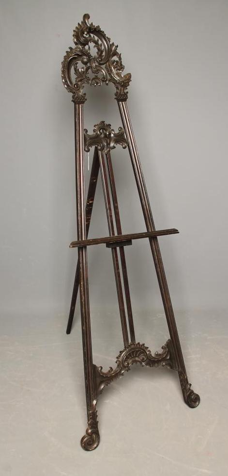 A VICTORIAN STAINED WOOD ARTIST EASEL in the Rococo Revival style Image