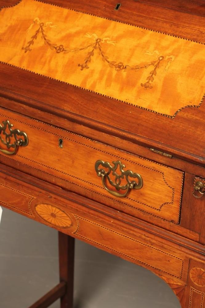 AN EDWARDIAN MAHOGANY BONHEUR DU JOUR with chequer stringing and inlaid paterae Image