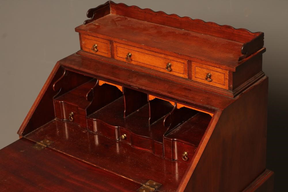 AN EDWARDIAN MAHOGANY BONHEUR DU JOUR with chequer stringing and inlaid paterae Image