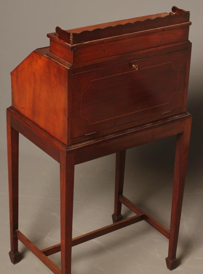 AN EDWARDIAN MAHOGANY BONHEUR DU JOUR with chequer stringing and inlaid paterae Image