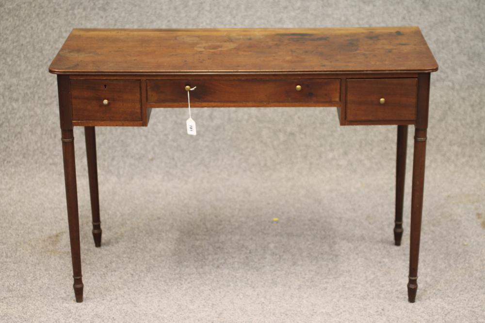 A REGENCY MAHOGANY KNEEHOLE WRITING/DRESSING TABLE of rounded oblong form with reeded edged top Image