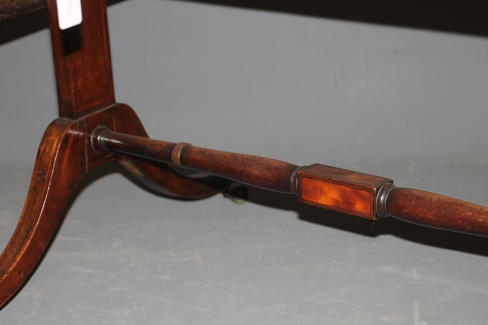 A REGENCY MAHOGANY SOFA TABLE of rounded oblong form with satinwood banding and stringing Image